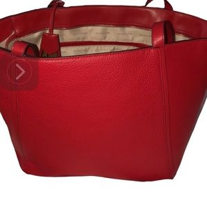 Micheal Kors large red leather bag   outside pockets, handles & crossbody strap
